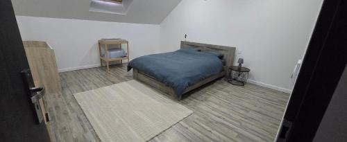 a bedroom with a bed and a tv in it at Lauberge de Villeron in Savigny-en-Revermont
