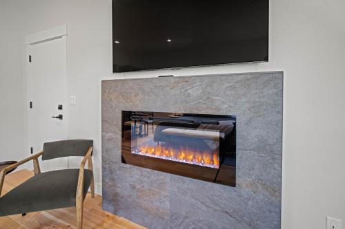 a fireplace in a living room with a tv above it at 18171-2 Forestbrook Loop in Bend