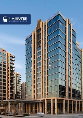 an image of a large glass office building at Novotel Dubai Gold District in Dubai