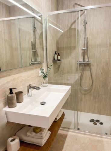 a bathroom with a sink and a shower at Residenza Castelnovo in Gubbio
