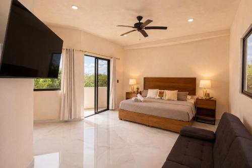 a bedroom with a bed and a flat screen tv at CISNE Luxury House in Xetna
