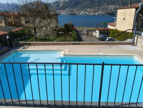 a swimming pool on the balcony of a house at Cozy Apartment - Iseo Lake in Paratico