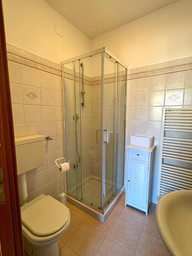 a bathroom with a shower and a toilet and a sink at Corso Ovidio - Casa vacanze in Sulmona