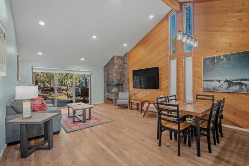 a living room with a table and a couch at 4 Quelah Condo in Sunriver