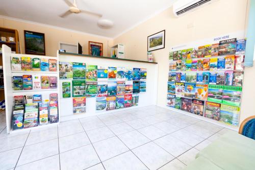 a book store with books on the walls at Trinity Beach Pacific in Trinity Beach