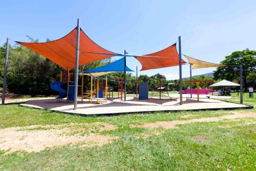 a park with a playground with a slide at Trinity Beach Pacific in Trinity Beach