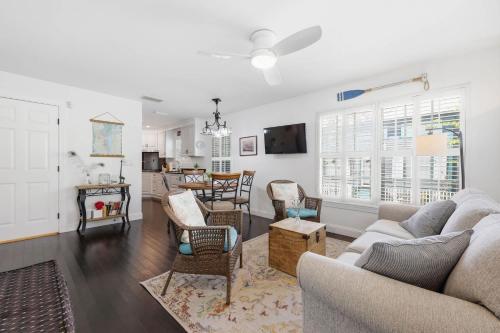a living room with a couch and chairs at Weeden Cottage in St. Augustine