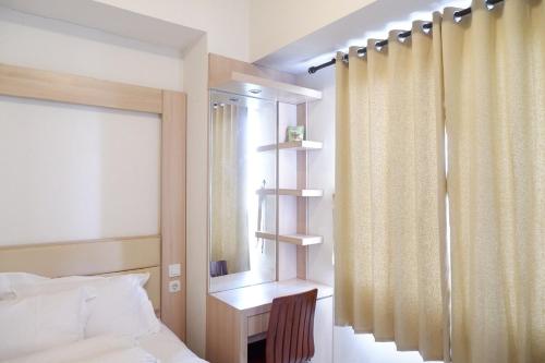 a bedroom with a bed and a window at apartment candiland room 45 m2 in Jomblang