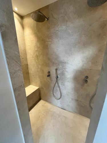 a bathroom with a shower with a sink and a shower at L'évasion in Saint-Jean-dʼArvey