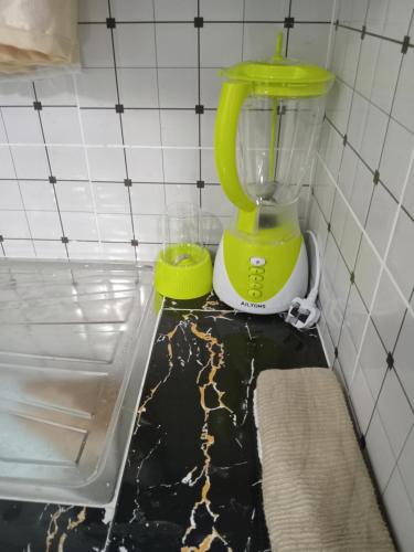 a green blender sitting on top of a counter at Classic Studio Bamburi in Mombasa