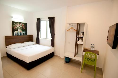 Postel nebo postele na pokoji v ubytování Hotel Cheqinn