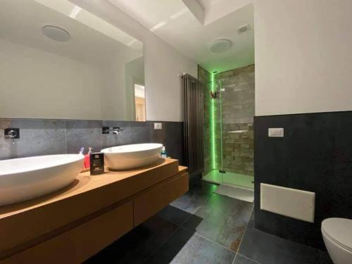 a bathroom with two sinks and a shower at Risorgimento House in Isernia