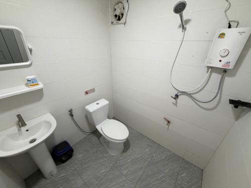 a bathroom with a toilet and a sink at NgopaKohKoodResort in Ban Bang Bao