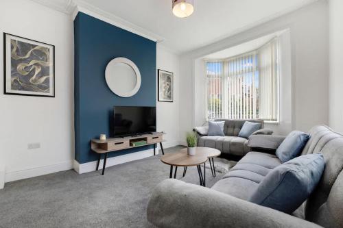 a living room with a couch and a tv at NEW! 3 Bedroom Home in Sunderland by Stay With Us, Perfect for Families & Contractors, FREE WiFi!! in Ryhope