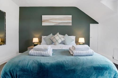 a bedroom with a large bed with two pillows on it at NEW! 3 Bedroom Home in Sunderland by Stay With Us, Perfect for Families & Contractors, FREE WiFi!! in Ryhope