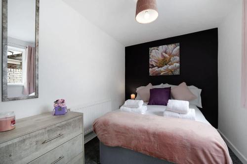 a bedroom with a bed with two pillows on it at NEW! 3 Bedroom Home in Sunderland by Stay With Us, Perfect for Families & Contractors, FREE WiFi!! in Ryhope
