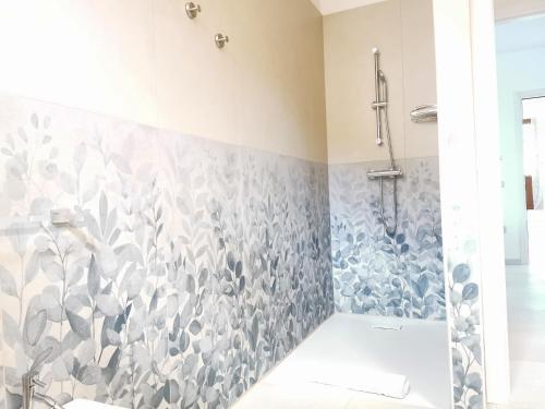 a bathroom with a shower with a shower curtain at Domus Soli in Teulada