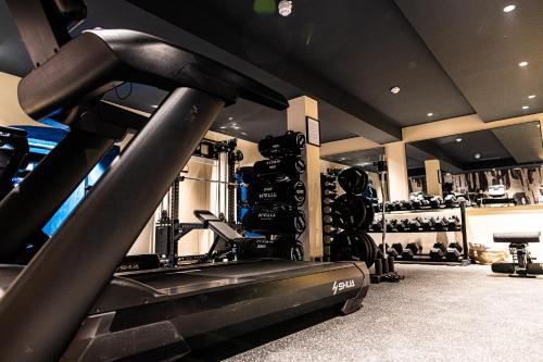 a room with a gym with a treadmill at The Royal Bell in Bromley