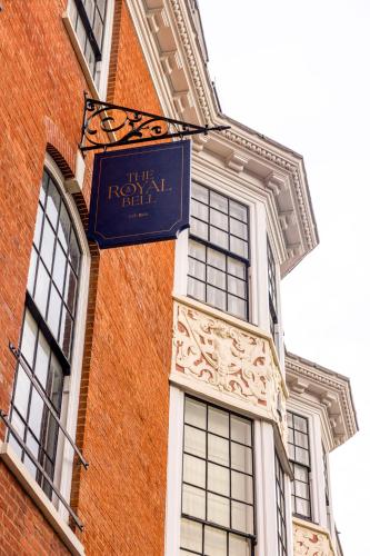 a blue sign on the side of a brick building at The Royal Bell in Bromley