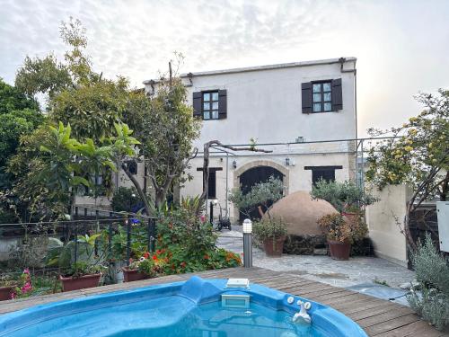 a swimming pool in front of a house at Vasilion Agrotourism in Polis Chrysochous