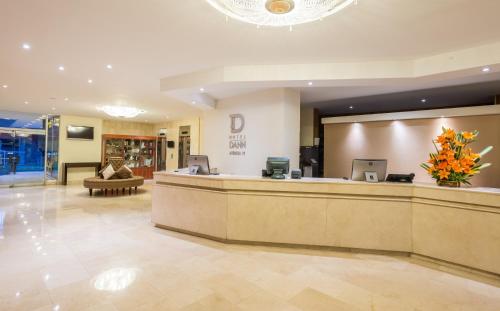 a lobby of a hotel with a reception desk at Hotel Dann Av. 19 in Bogotá