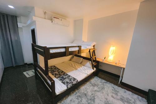 a small room with two bunk beds in it at Stop-N-Stay Inn in Valencia