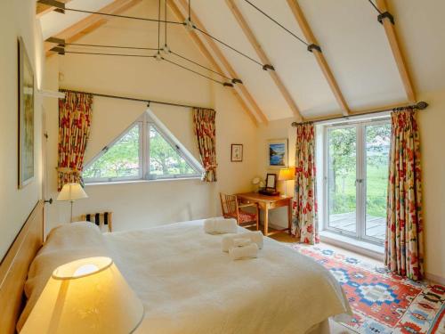 a bedroom with a large bed and a window at 5 Bed in Aberlour oc-ca280 in Carron