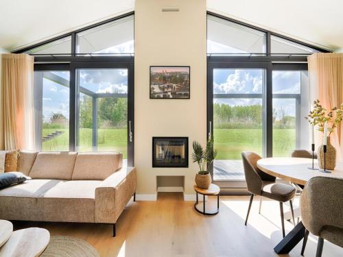 a living room with a couch and a table at Amsterdam in Oud-Ade