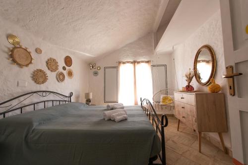 a bedroom with a bed with a teddy bear on it at Kite Hostel Stagnone in Marsala