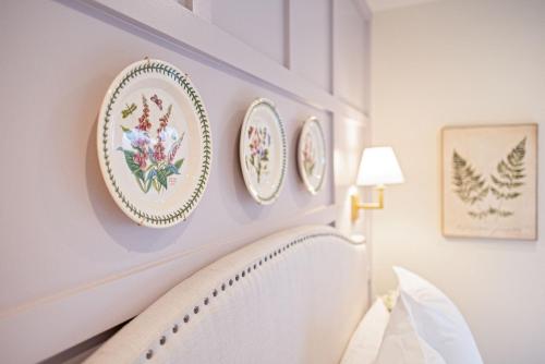 a room with four plates on the wall at Kildahl House - Boutique Farmhouse Suite #3 in West Dundee