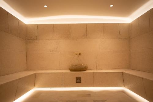 a bathtub with a vase sitting on top of it at Loft & SPA resort ROOMs in Palyanytsya
