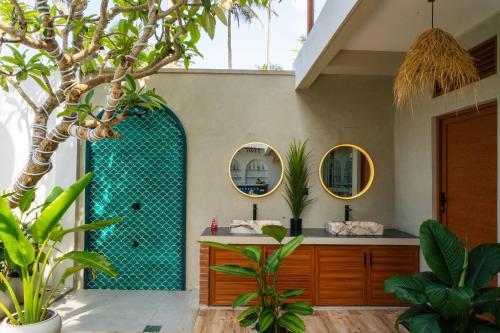 a bathroom with a green shower and two mirrors at I Ahangama - 100m to Kabalana Beach in Ahangama