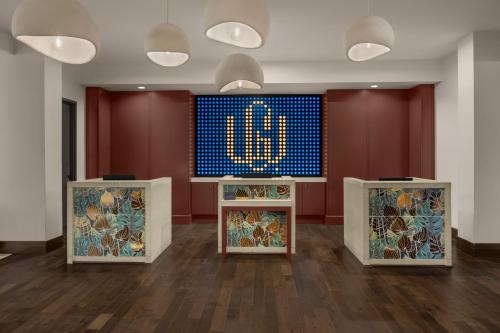 a room with two counters with a clock on the wall at The Westshore Grand, A Tribute Portfolio Hotel, Tampa in Tampa