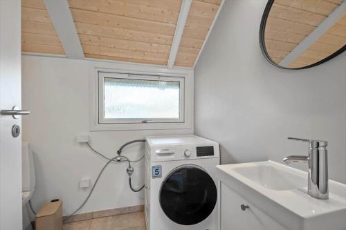 a washing machine in a bathroom with a sink at VE508-Oksbol-Blomstervangen-123 in Oksbøl