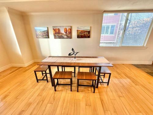 a dining room table and chairs in a room at Spacious Townhome Near Downtown in Salt Lake City