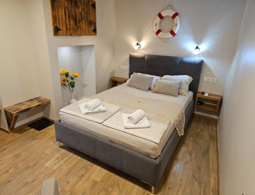 a bedroom with a bed with two towels on it at Sea Paradise Piran in Piran