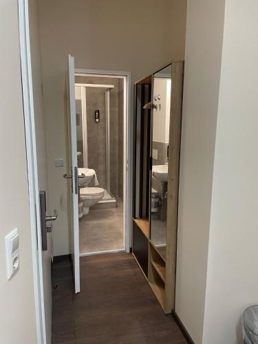 a bathroom with two sinks and a mirror at Hotel Aster an der Messe in Berlin