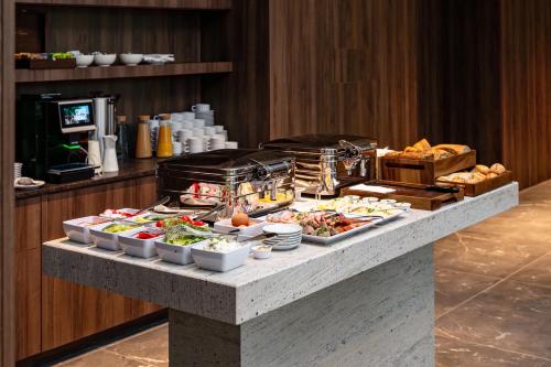 a buffet of food on a table in a hotel at Boulevard Drobnera SPA&Wellness - Restaurant PONTI - Widok na Odre in Wrocław
