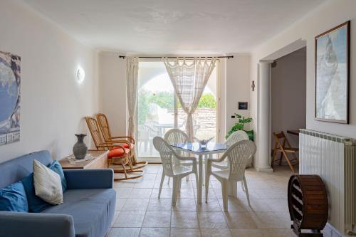 a living room with a table and chairs at Villa Claudia - YourPlace Abruzzo in Termoli