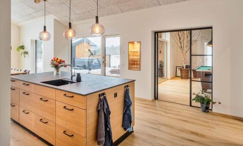 a kitchen with a sink and a counter top at VE250-Vejers-Strand-Engesovej-56 in Vejers Strand