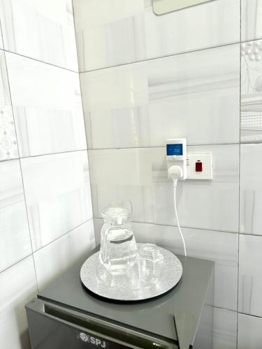 a phone on top of a counter in a room at The Reset Stay in Kampala