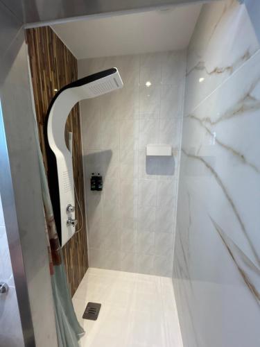 a bathroom with a shower with a glass door at Bela vista AL in Paredes de Coura