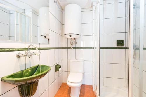 a bathroom with a sink and a toilet at 1Sarri - Llafranc in Llafranc