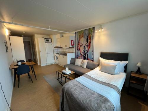 a bedroom with a bed and a couch in a room at North Home in Skellefteå