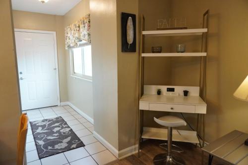 a small room with a desk and a stool at River Place Condos #401 2BD in Pigeon Forge