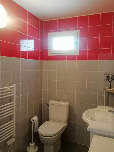 a bathroom with a toilet and a sink at Gîte d'étape Chez Isa in Vers