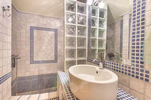 a bathroom with a sink and a mirror at Villa Markella in Chrysi Ammoudia