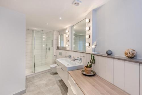 a white bathroom with a sink and a toilet at 4 Bed in Hythe oc-p30519 in Hythe