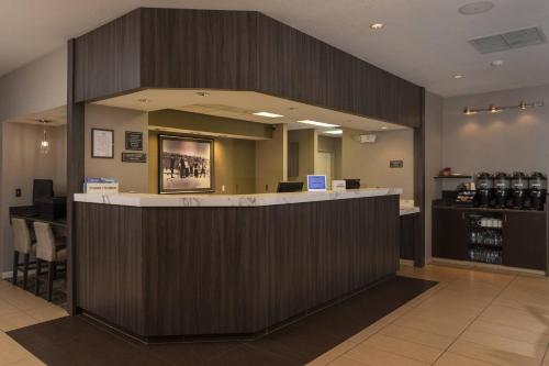 a large lobby with a counter in a store at Residence Inn by Marriott Durango Downtown in Durango