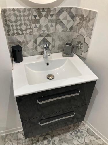 a bathroom with a white sink and a mirror at Cassis et ses merveilleuses Calanques in Cassis